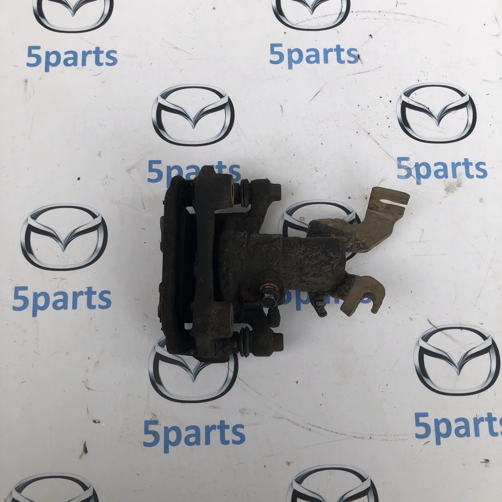 Суппорт тормозной задний правый M6 (GG,GH) 2002-2012