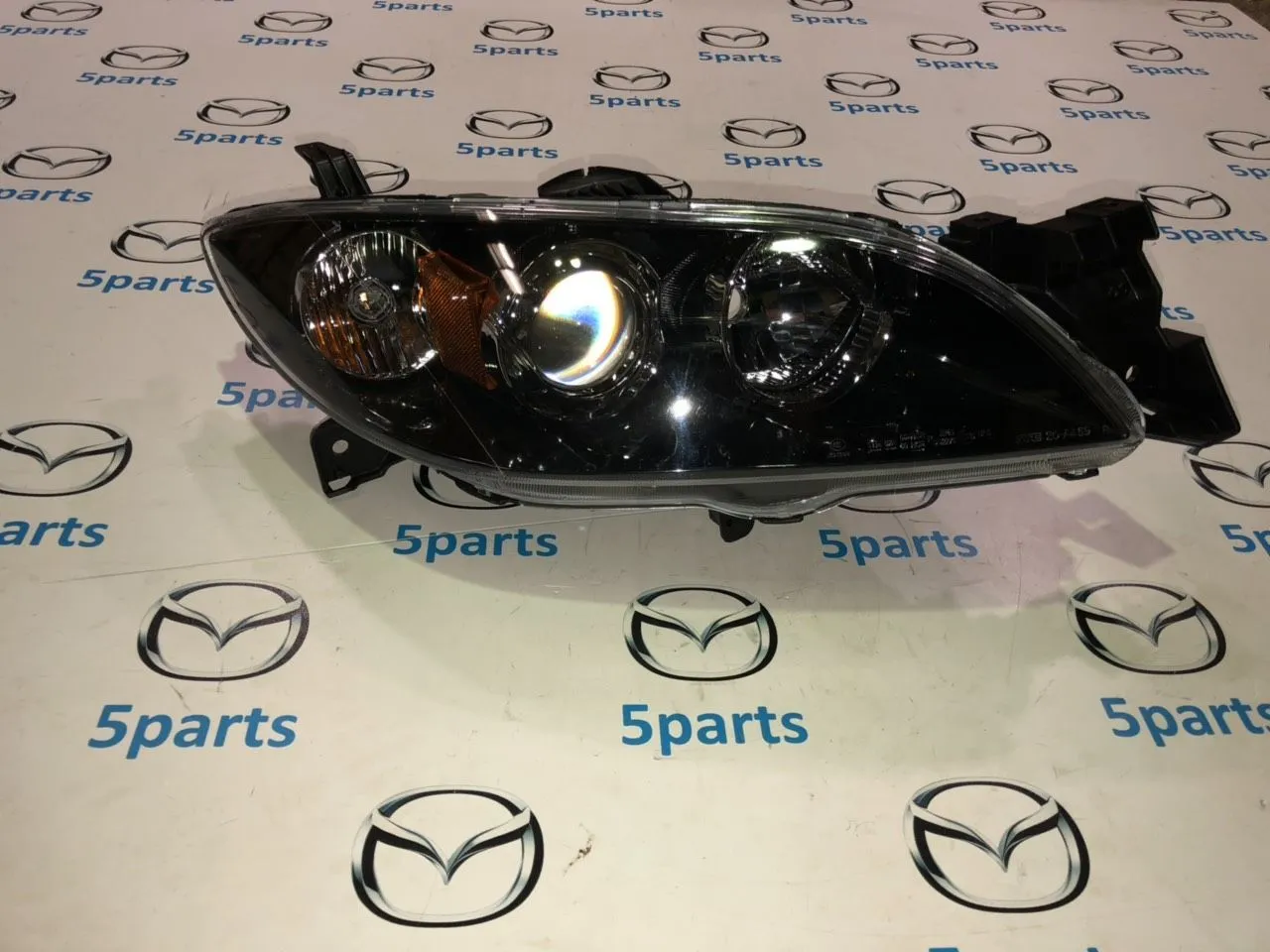 Фара основная правая M3 (BK) SDN 2003-2009