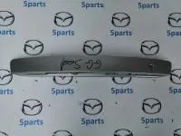 Накладка подсветки номерного знака M6 (GG) SDN 2002-2007 купить в Москве