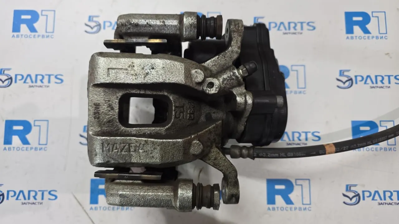 Суппорт тормозной задний левый электрический CX-9 (TС) 2017-2021