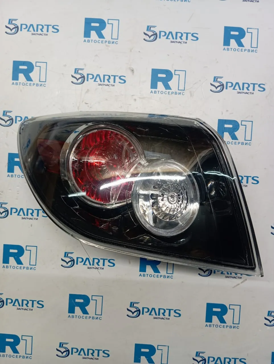 Фонарь внешний левый M3 (BK) HB 2006-2009